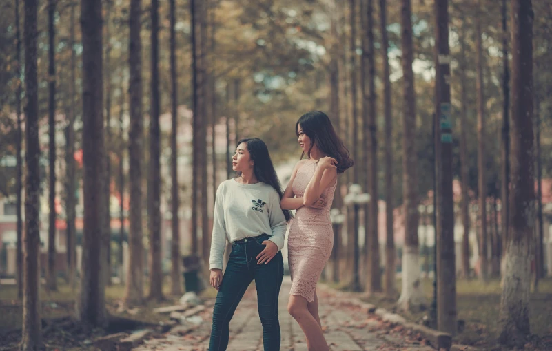 two women standing next to each other in a forest, pexels contest winner, standing on the street, avatar image, asian women, slim and tall