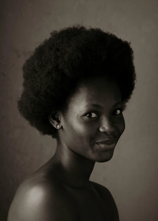 a black and white photo of a woman with an afro, a black and white photo, inspired by Chinwe Chukwuogo-Roy, studio medium format photograph, portrait”, light-brown skin, classical portrait