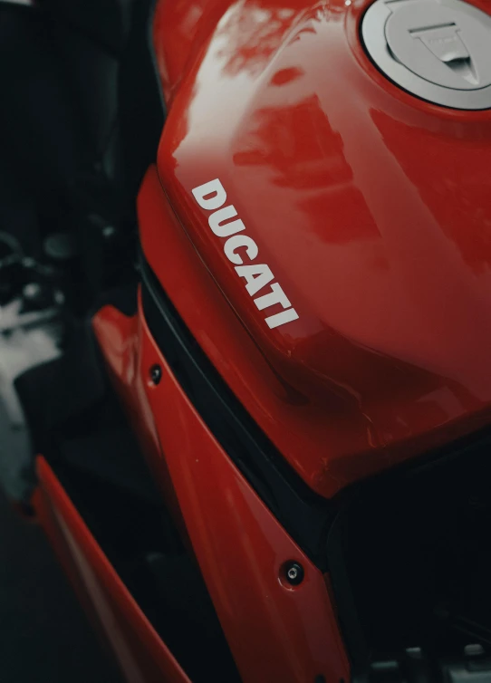 the ducati logo on the red and black bike