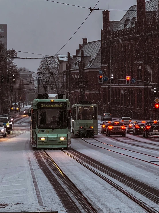 a green bus driving down a snow covered street, by Christen Dalsgaard, pexels contest winner, happening, rainy evening, trams, thumbnail, 🚿🗝📝