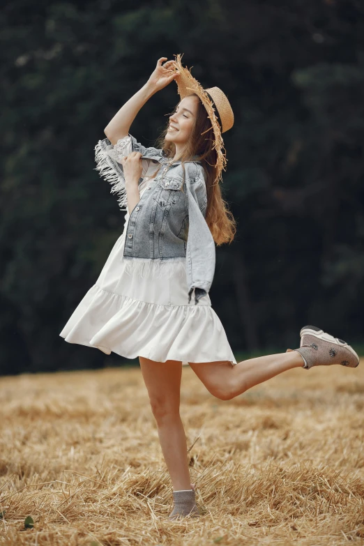 woman running through an open field, her leg up with the camera in motion