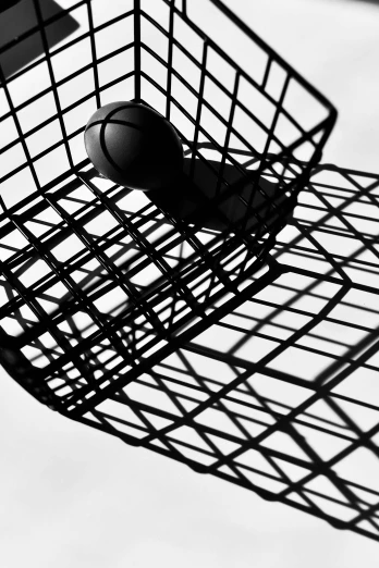 a black and white photo of a basketball in a basket, an abstract drawing, inspired by Marcel Duchamp, unsplash, ffffound, chairs, silhouette!!!, detail structure