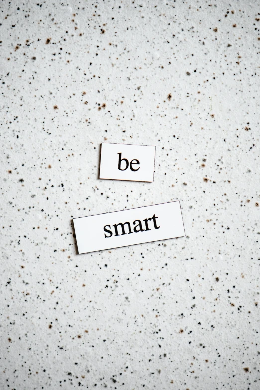 a piece of paper with the words be smart on it, trending on pexels, magnetic, ceramic, carl sagan, white