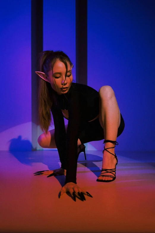 a woman sitting on top of a floor next to a pole, an album cover, inspired by Nan Goldin, unsplash, renaissance, metal cat ears and glowing eyes, goblin girl dnd character, ariana grande as a sith, profile image