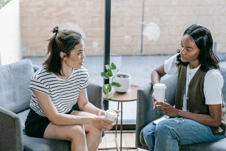 two women sitting on a couch talking to each other, trending on pexels, fiona staples and kinu nishimura, two cups of coffee, charli bowater and artgeem, mental health