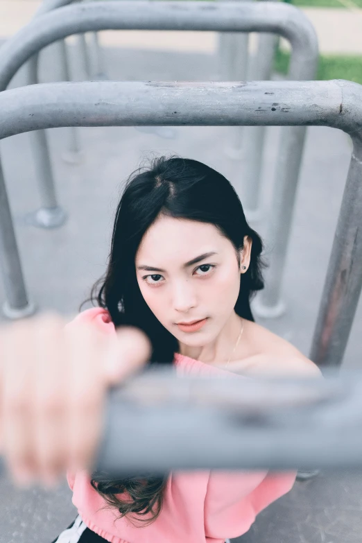 young woman in pink top sitting in chair