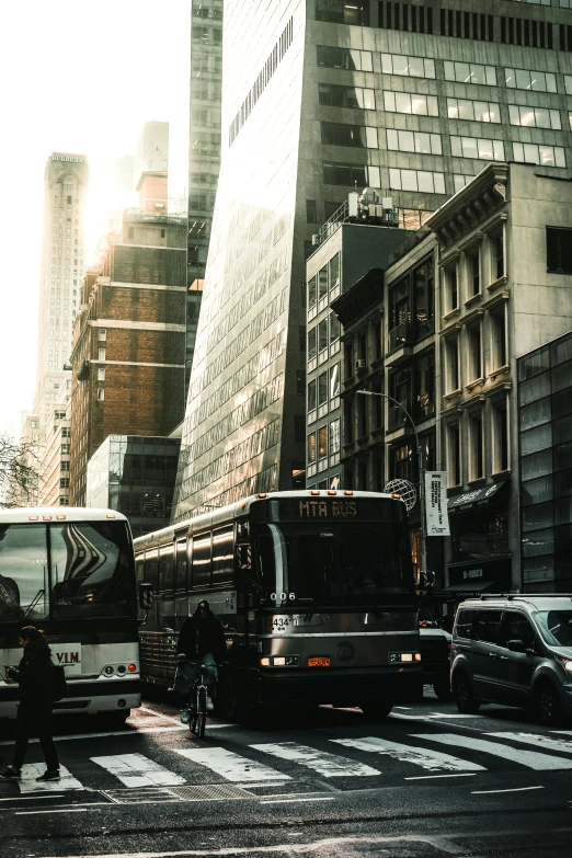 a city street filled with lots of traffic and tall buildings, pexels contest winner, modernism, public bus, post apocalyptic new york, instagram story, buses