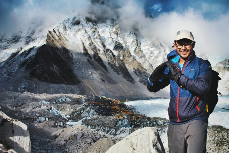 man standing on top of a hill smiling