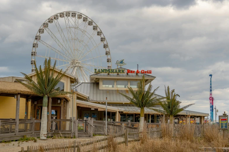 a restaurant with a ferris wheel in the background