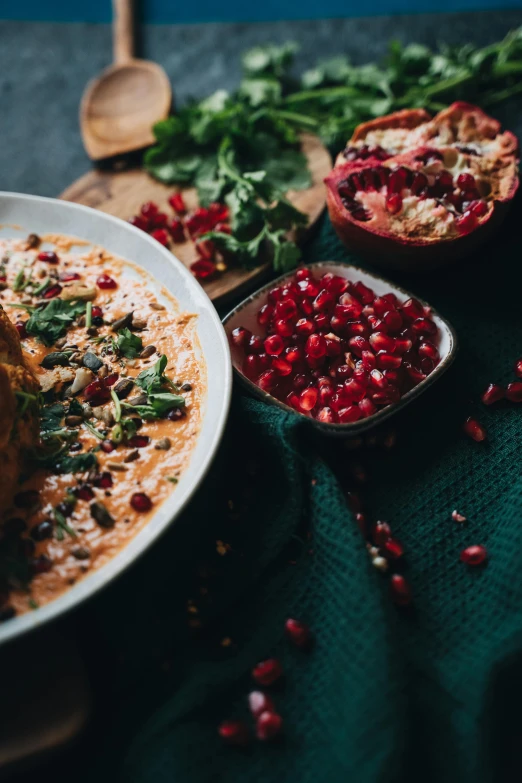 a plate of food sitting on top of a table, by Julia Pishtar, pexels contest winner, persian design, pomegranate, soup, chuvabak