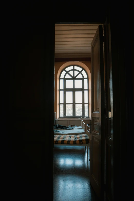 a window view of a bed and sink