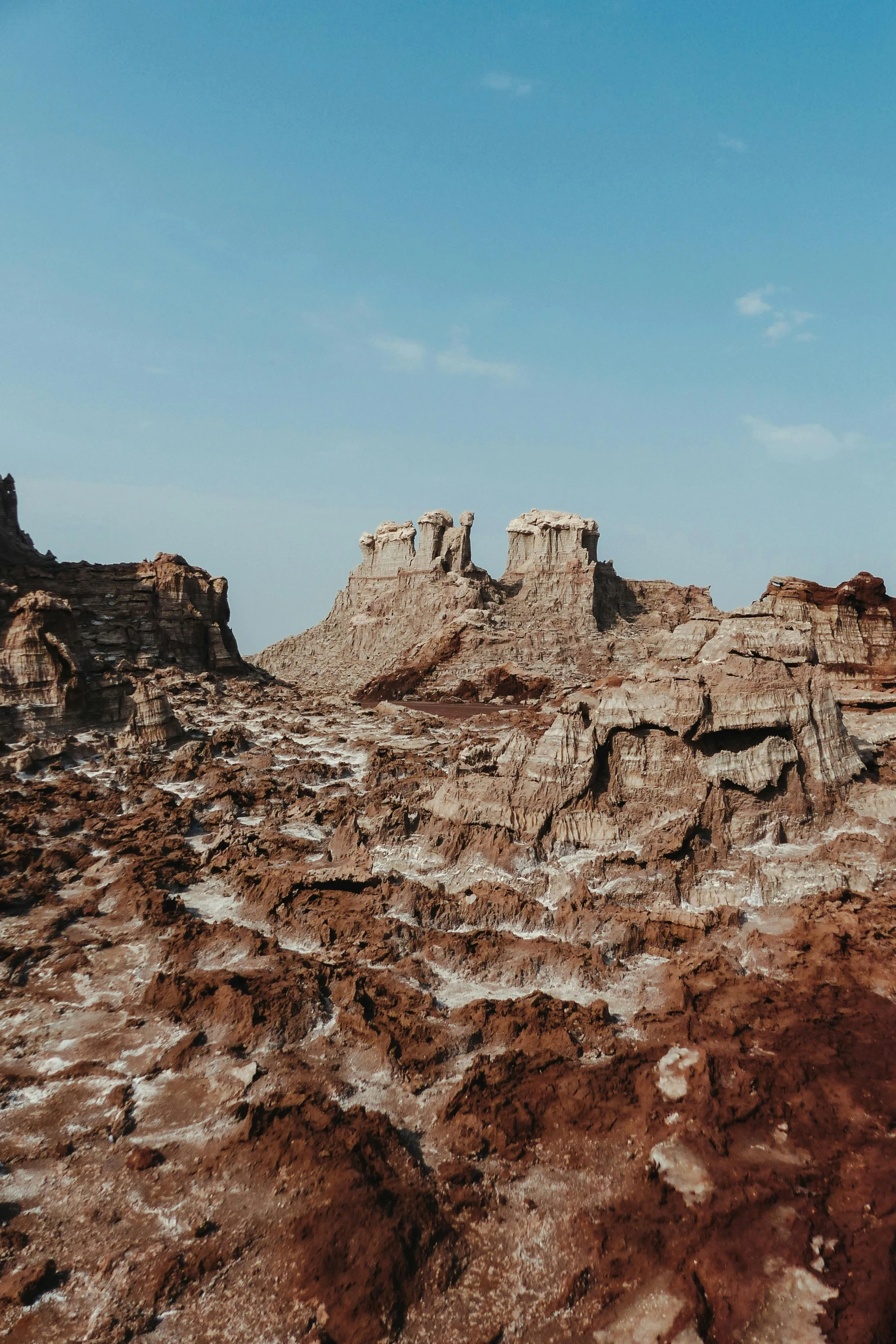 several cliffs of stone against the blue sky