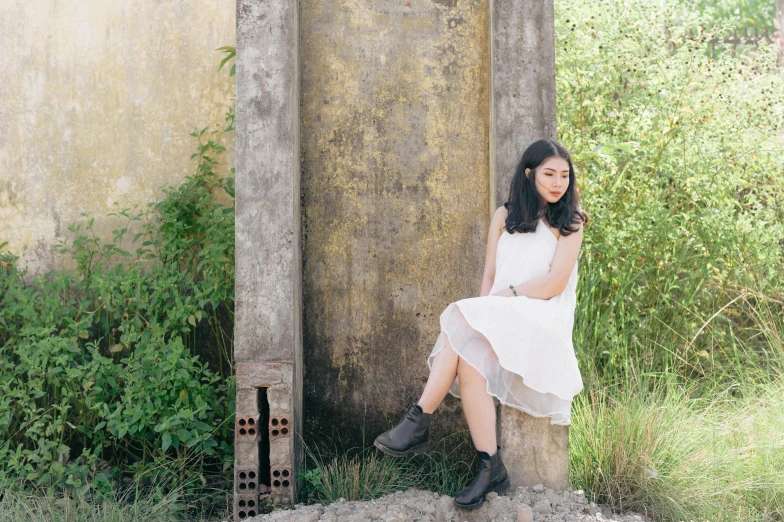 a woman in a white dress sitting on a tree stump, an album cover, inspired by Ruth Jên, unsplash, wearing tall combat boots, waiting behind a wall, asian girl, profile picture 1024px