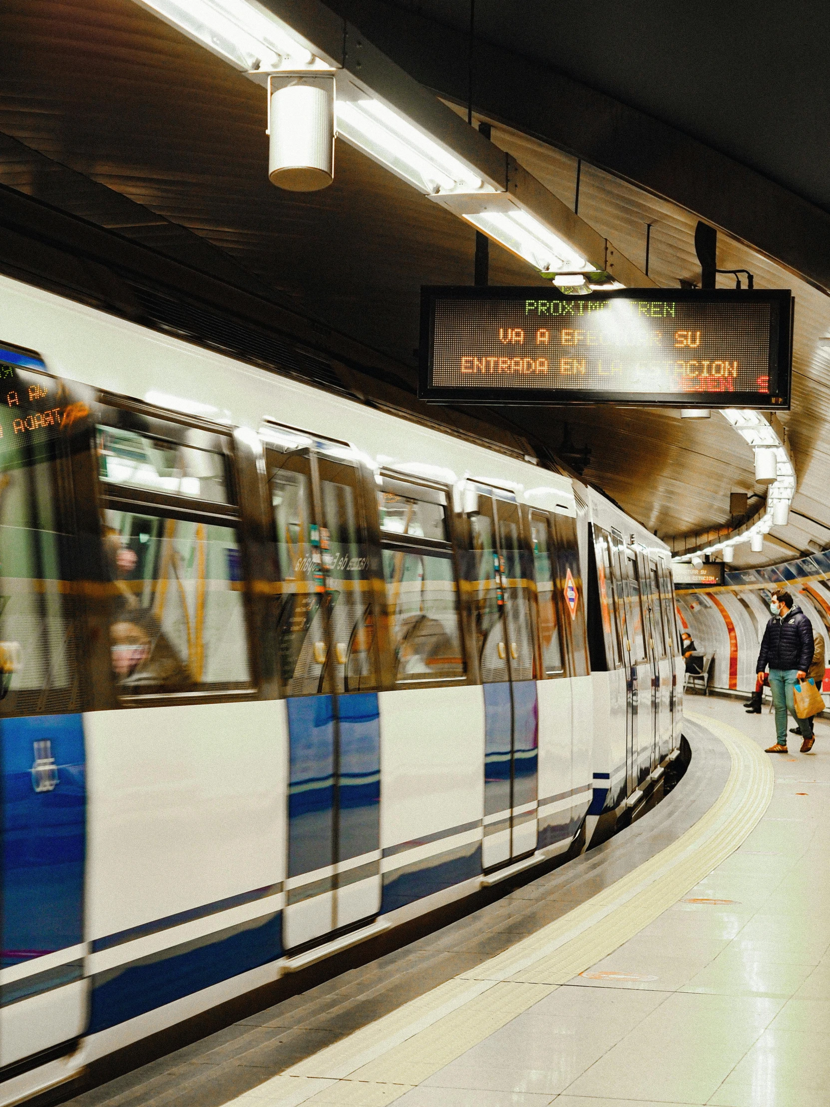 a blue and white train pulling into a train station, unsplash, underground lab, 🚿🗝📝, profile image, instagram story