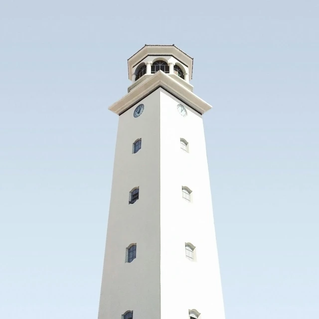 a tall white tower with a clock on top of it, an album cover, by Gavin Hamilton, unsplash, minimalism, farol da barra, bright summer day, albuquerque, lighthouse