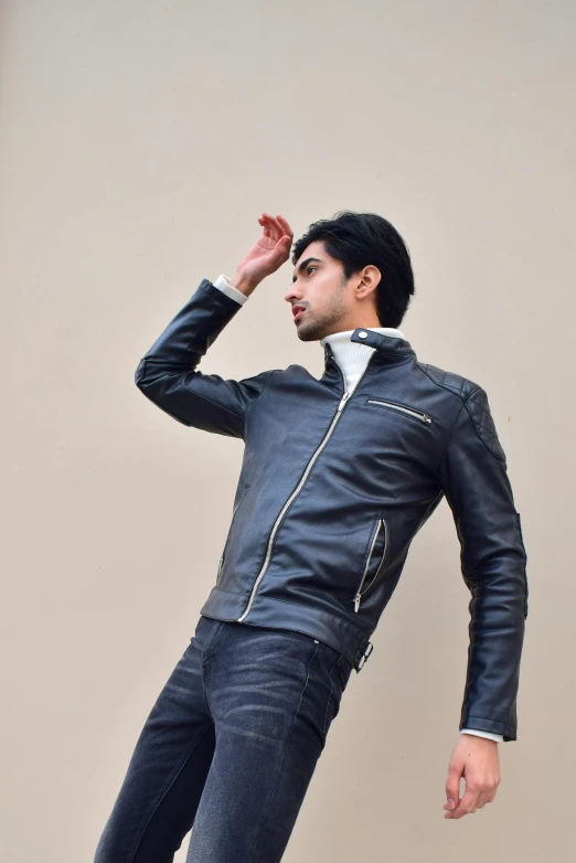 a male model with a leather jacket and black shirt