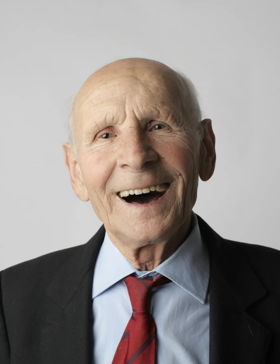 a close up of a person wearing a suit and tie, inspired by Jerry Eisenberg, while smiling for a photograph, two skinny old people, profile image, darius zawadzki