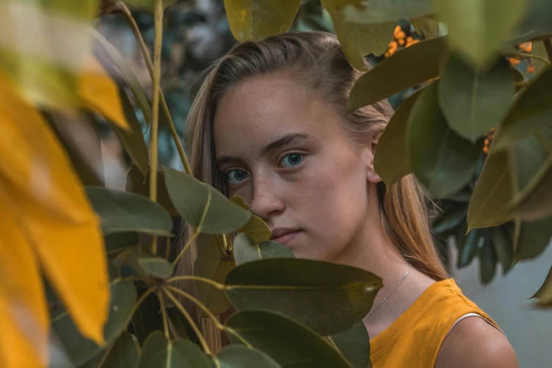 a close up of a person near a tree, sydney sweeney, portrait 8 k, the yellow creeper, unsplash photo contest winner