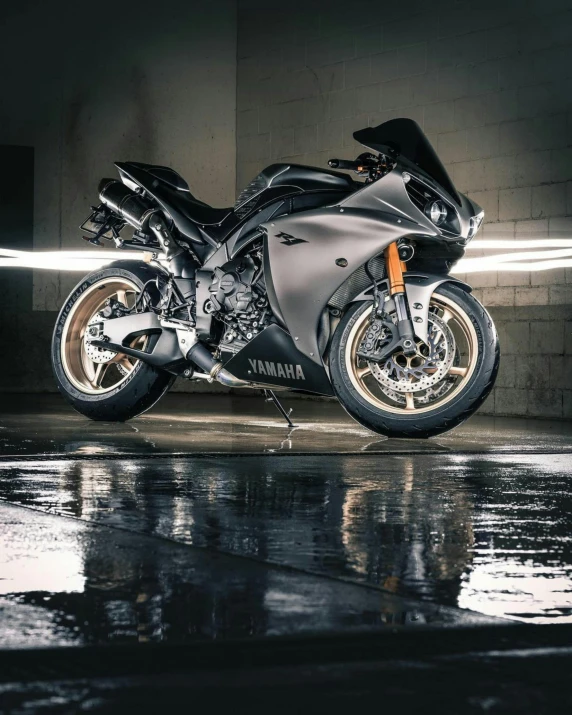 a motorcycle that is parked in a garage, pexels contest winner, photorealism, wet asphalt, lighting her with a rim light, samurai vinyl wrap, gif