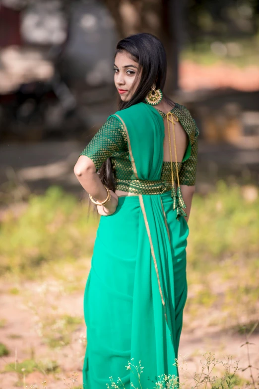 a woman in a green sari