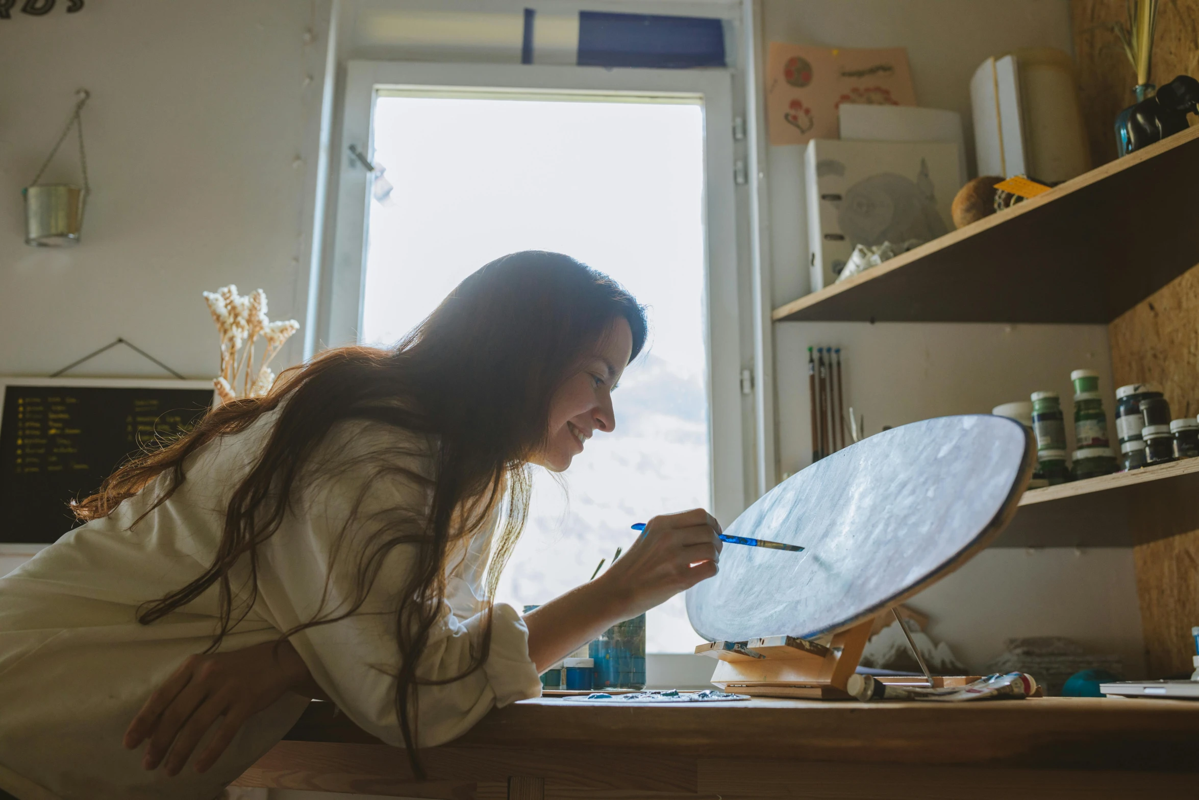 a woman brushing her teeth in front of a mirror, a photorealistic painting, pexels contest winner, studying in a brightly lit room, profile image, in a workshop, resin and clay art