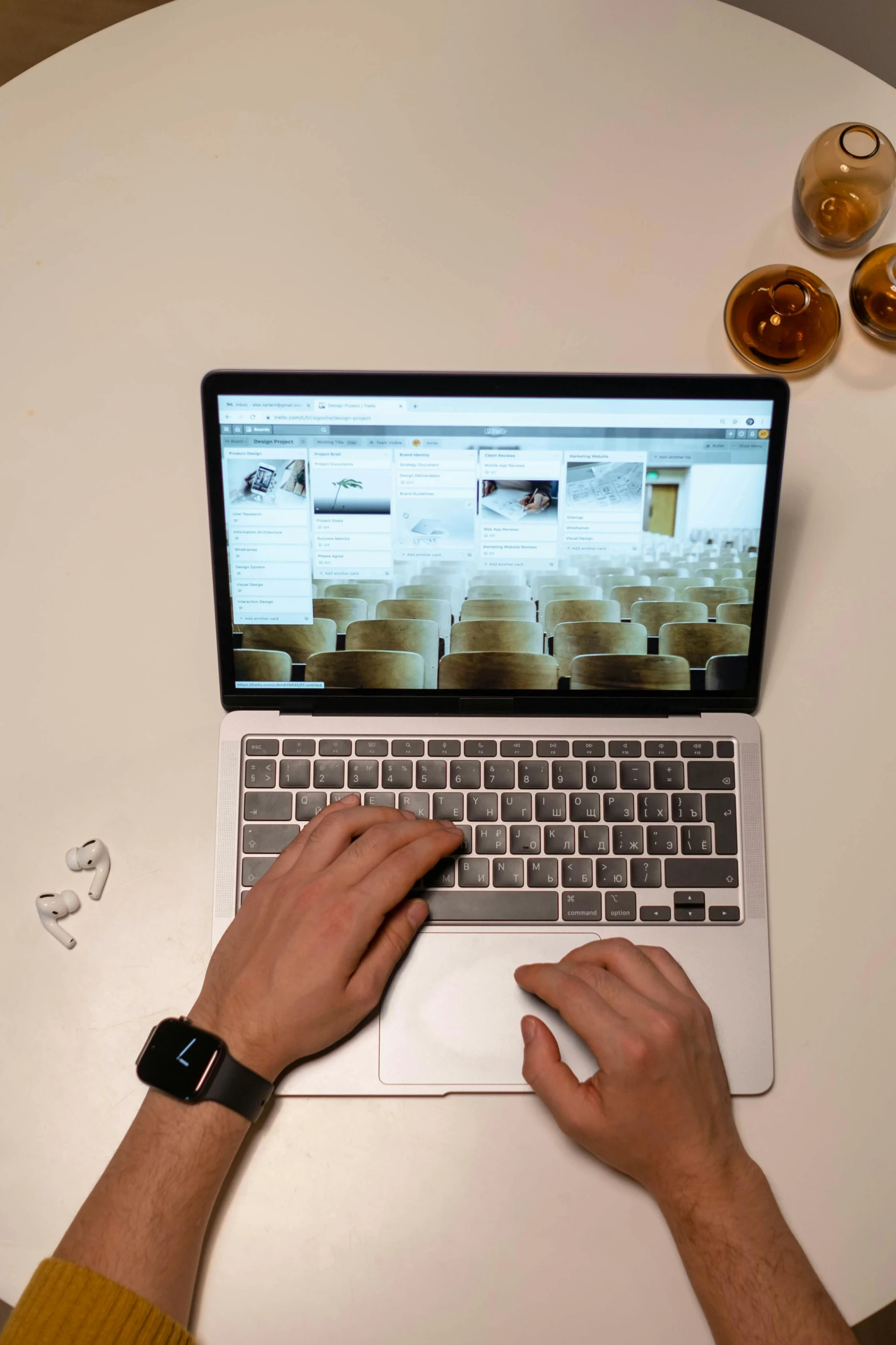 a man sitting at a table using a laptop computer, by Matthias Stom, pexels contest winner, video art, apple design, concert, flatlay, thumbnail