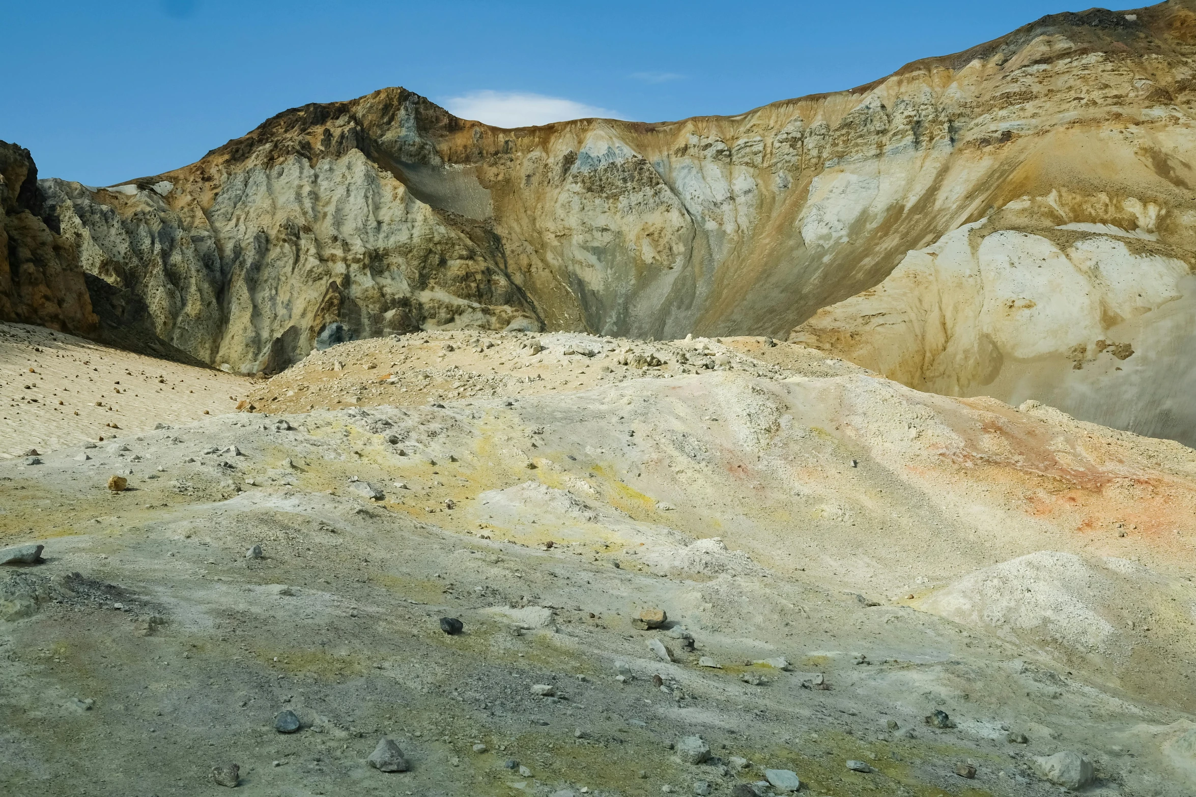 a very large hill covered in sand and rocks