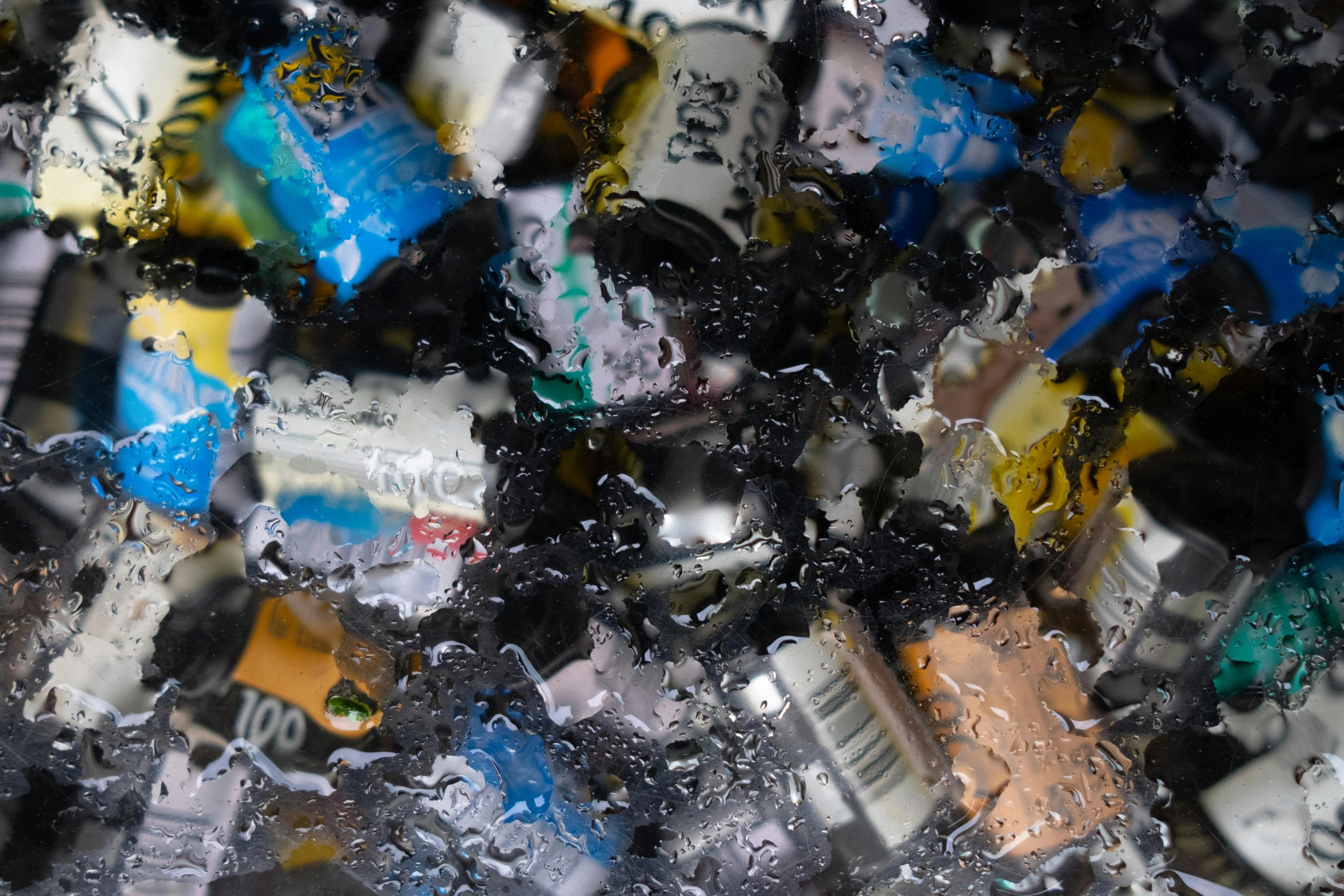 a mixture of soda bottles all together with lots of them falling off