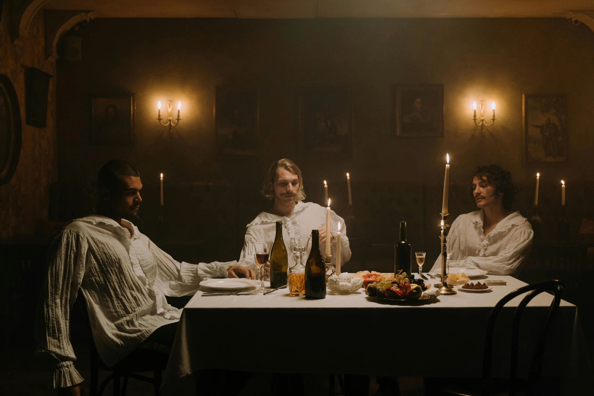 a group of people sitting around a dinner table, a portrait, inspired by Caravaggio, pexels contest winner, renaissance, andrei tarkovsky scene, 3 actors on stage, southern gothic scene, official music video