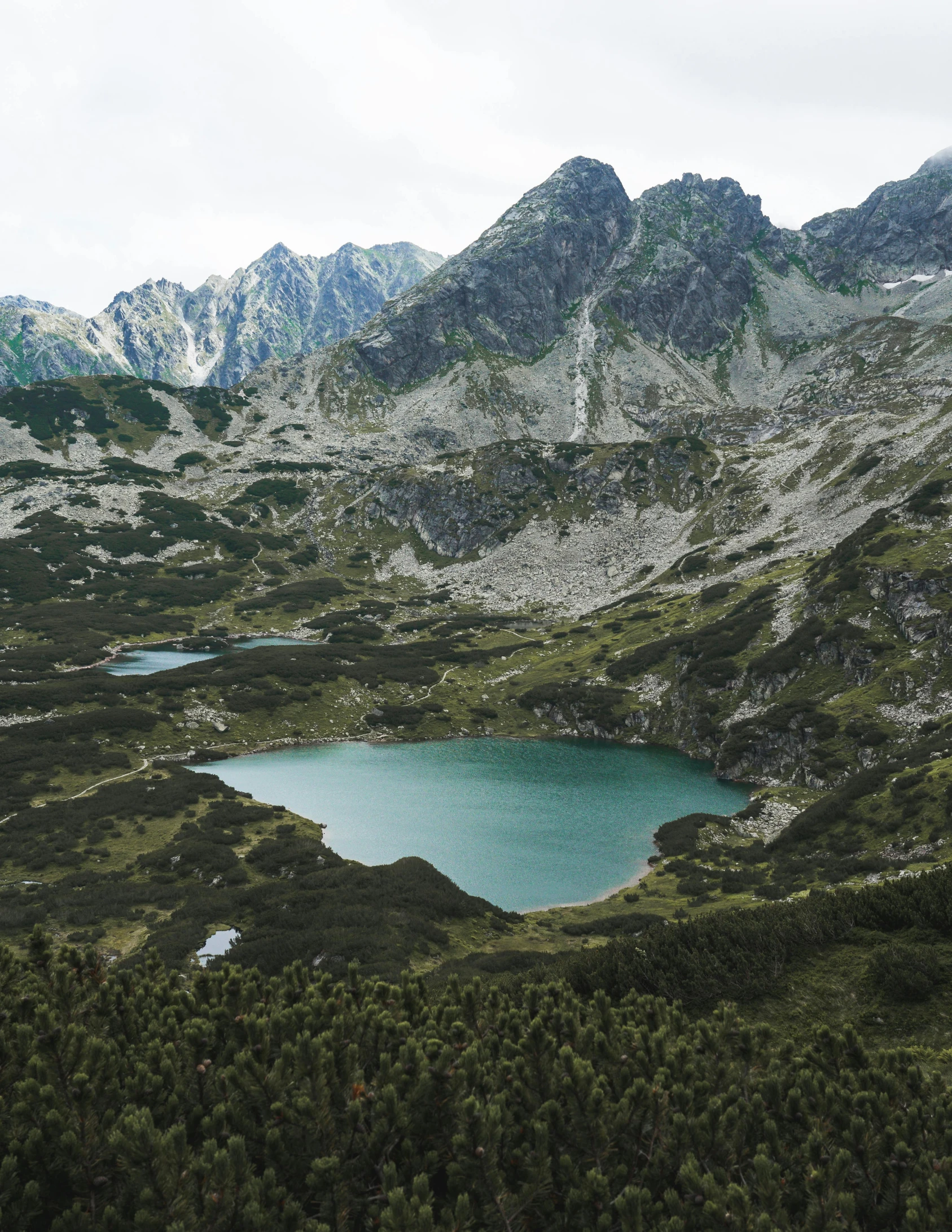 a group of mountain range with some water in it