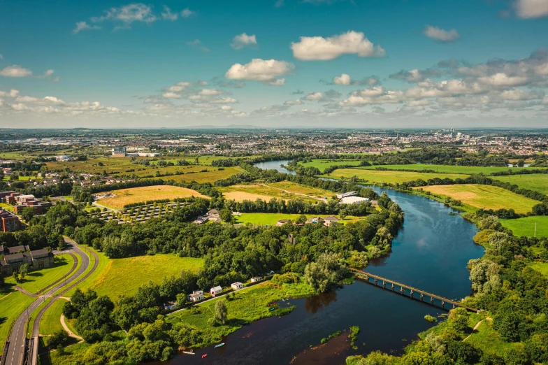 an aerial view of a river and a city