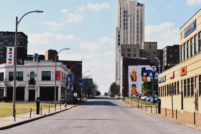 a city street with a clock tower in the background, by Kristin Nelson, unsplash, memphis rap, sparsely populated, pitt, iu