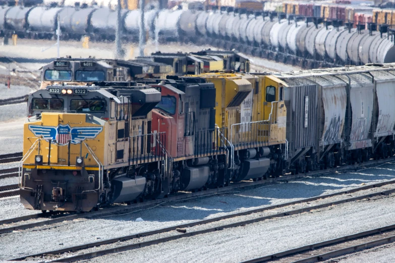 a large long train on a steel track, by Jeffrey Smith, unsplash, photorealism, avatar image, shipping containers, engines, close-up photo