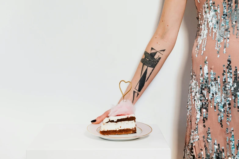 a woman holding a plate with a piece of cake on it, a tattoo, inspired by Hedi Xandt, trending on pexels, aestheticism, cats party, plated arm, slightly minimal, product introduction photo