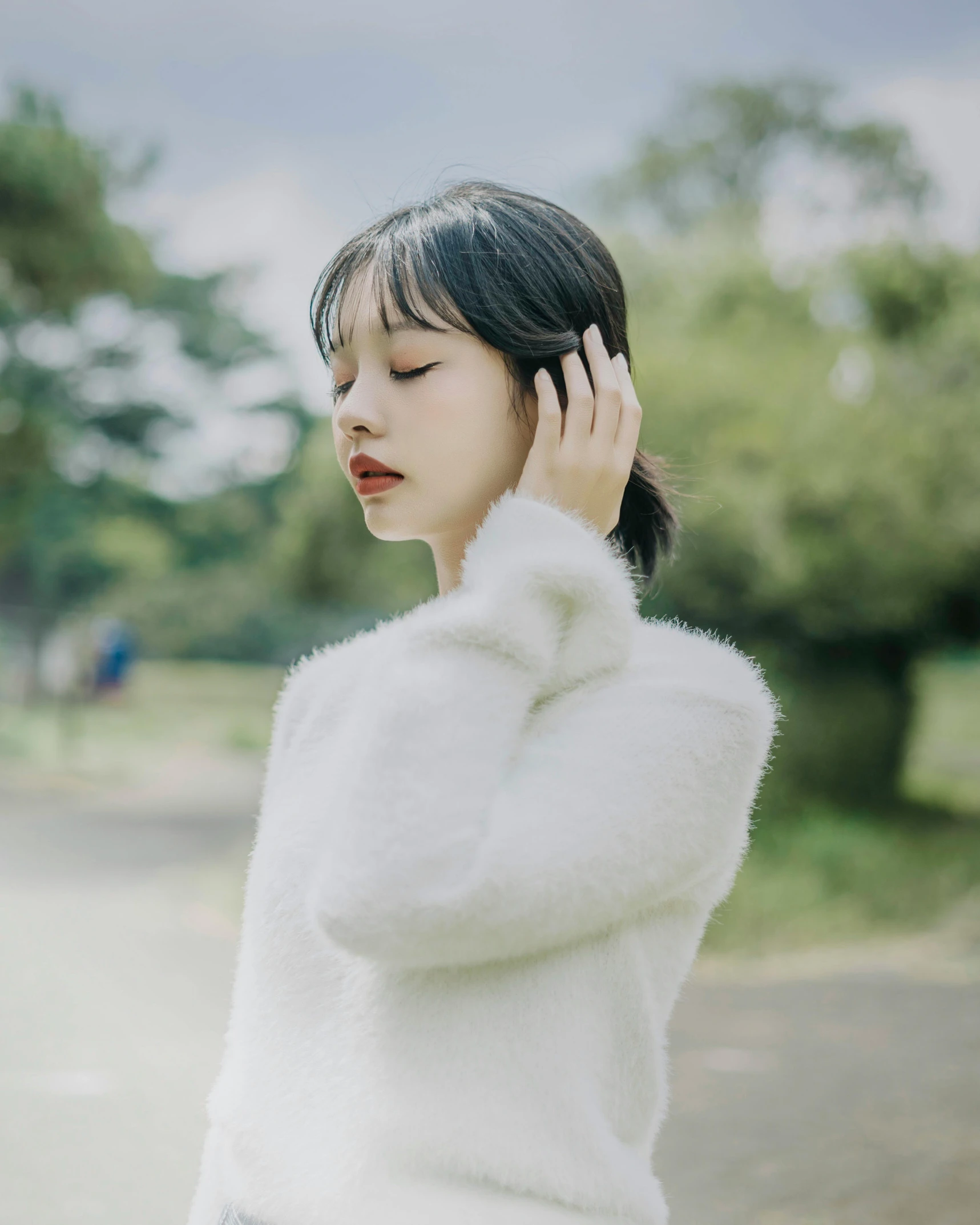 a woman in a white sweater talking on a cell phone, an album cover, by Tan Ting-pho, unsplash, aestheticism, fluffy bangs, park ji-min, elegant profile pose, 🤤 girl portrait