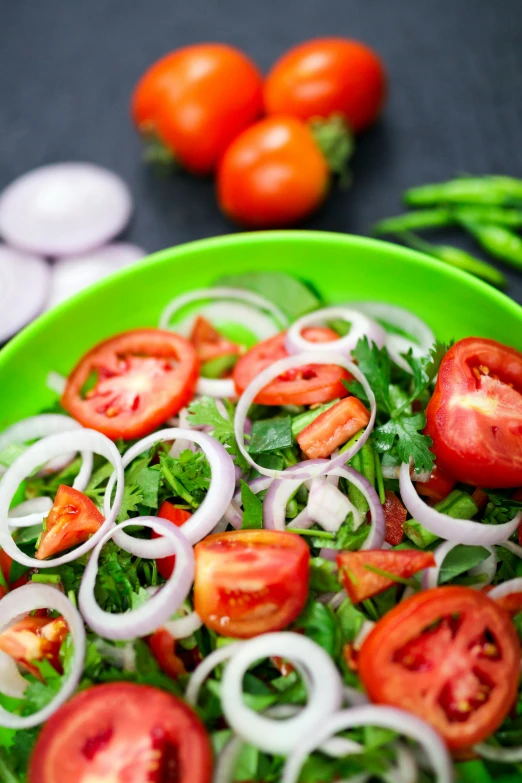 a green bowl filled with tomatoes and onions, by Julia Pishtar, salad, alphonso azpiri, square, high quality photo