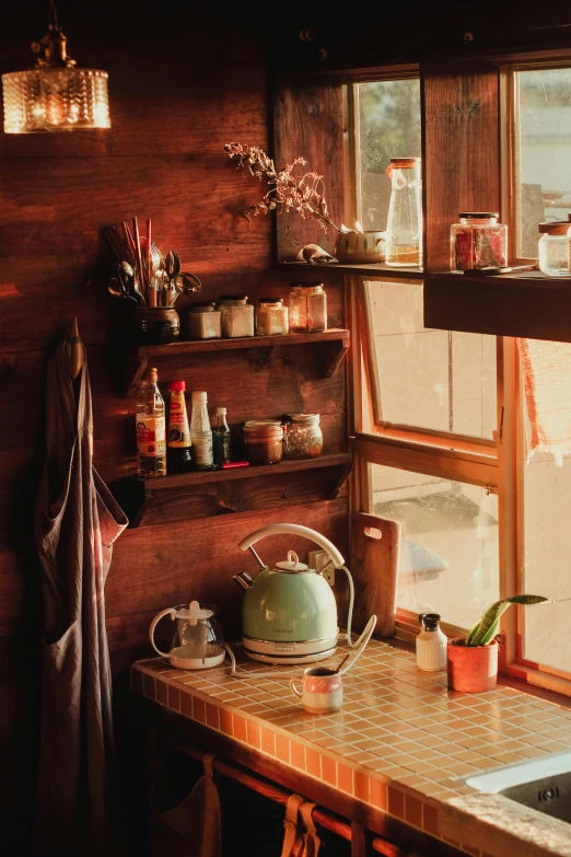 an old rustic looking kitchen with pots on the counter