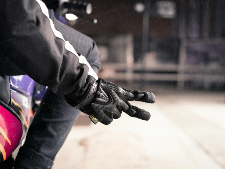 a man is riding a motorcycle wearing a motorcycle helmet