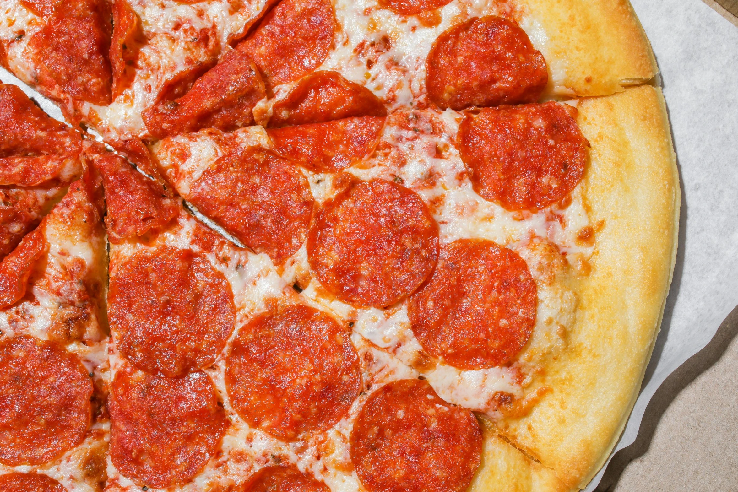 a pepperoni pizza sitting on top of a cardboard box, buzzed sides, close-up from above, tangelos, thumbnail