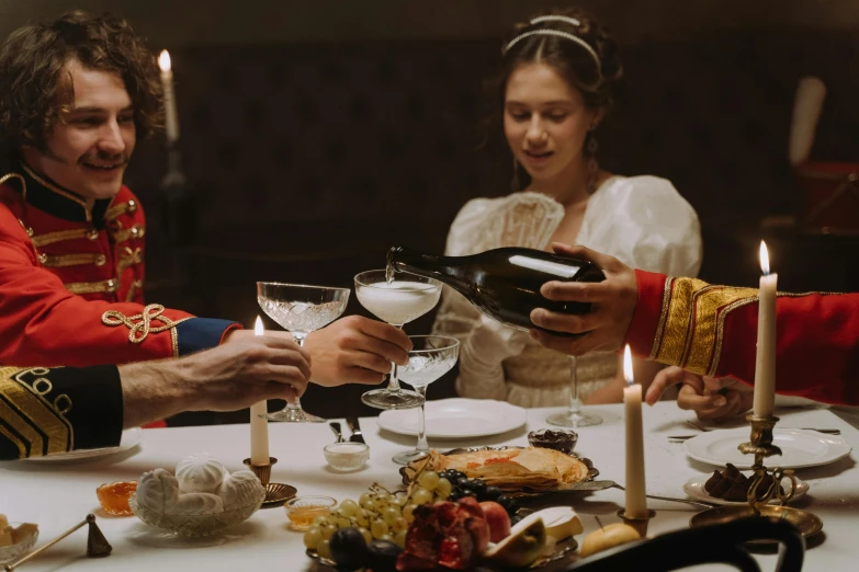 an image of a couple dressed up for a formal feast