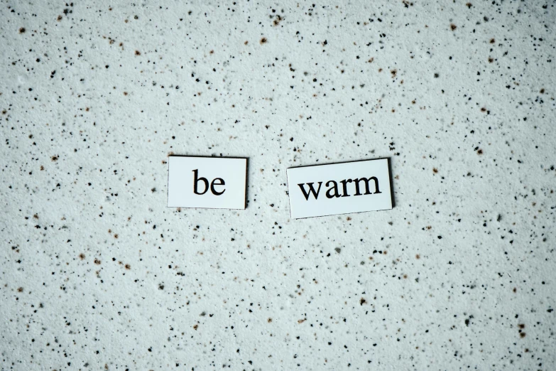 two pieces of paper with the words be warm on them, trending on pexels, minimalism, magnetic, brick, skin, cold