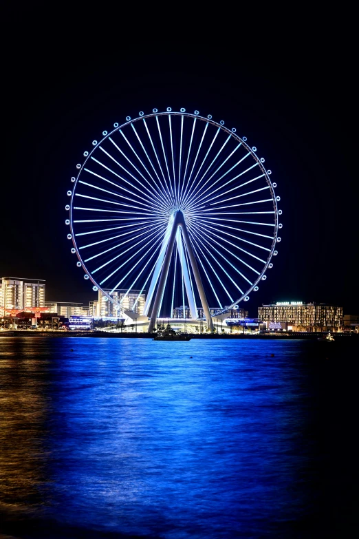 a large ferris wheel sitting on top of a body of water, by Niko Henrichon, dubai, epic lighting”, ..', nice face