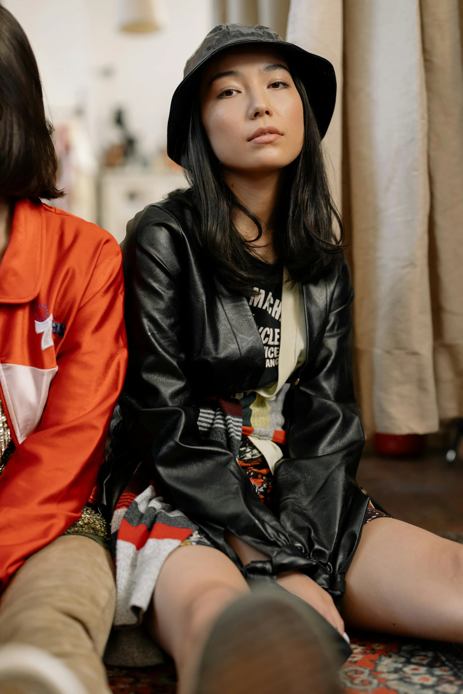 a couple of women sitting next to each other, trending on pexels, japanese streetwear, dressed in short leather jacket, 15081959 21121991 01012000 4k, blackhair