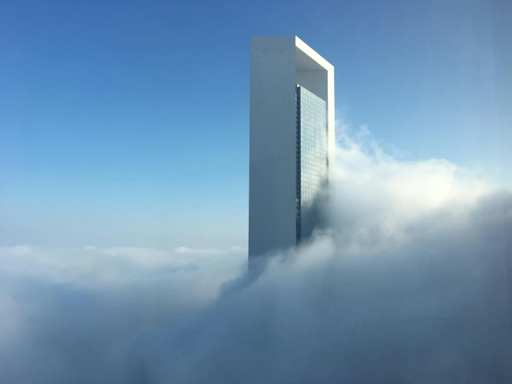 a tall building in the middle of a cloud filled sky, arabia, united nations, fan favorite, monolith