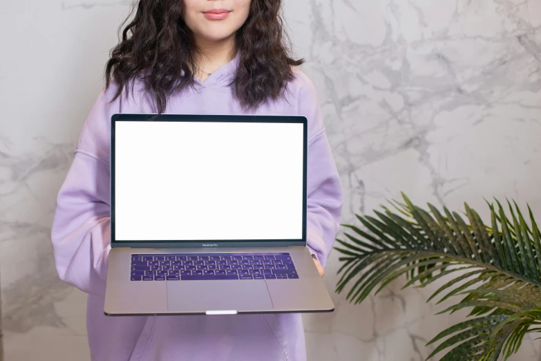 a woman holding a laptop with a white screen, a computer rendering, by Julia Pishtar, trending on pexels, purple robes, apple design, no - text no - logo, full frontal