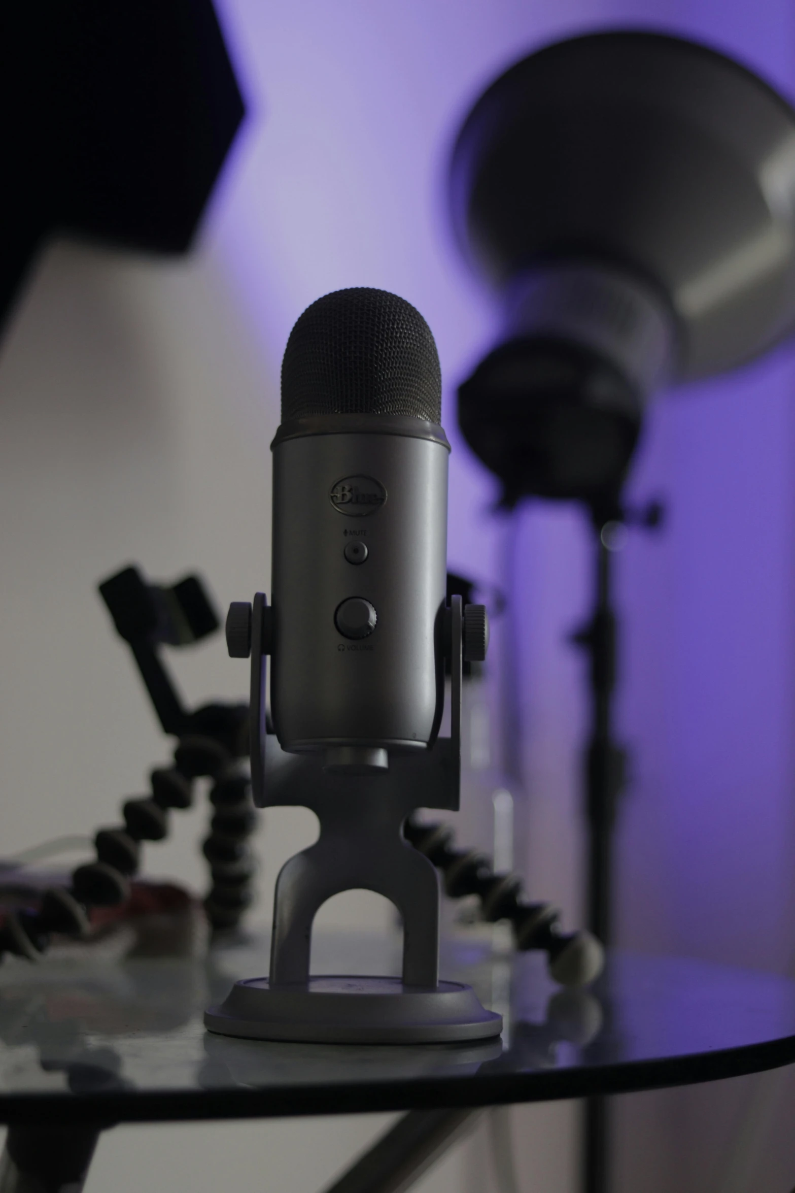 a microphone sitting on top of a glass table, featured on reddit, altermodern, purple volumetric lighting, damaged webcam image, cortana, promo image