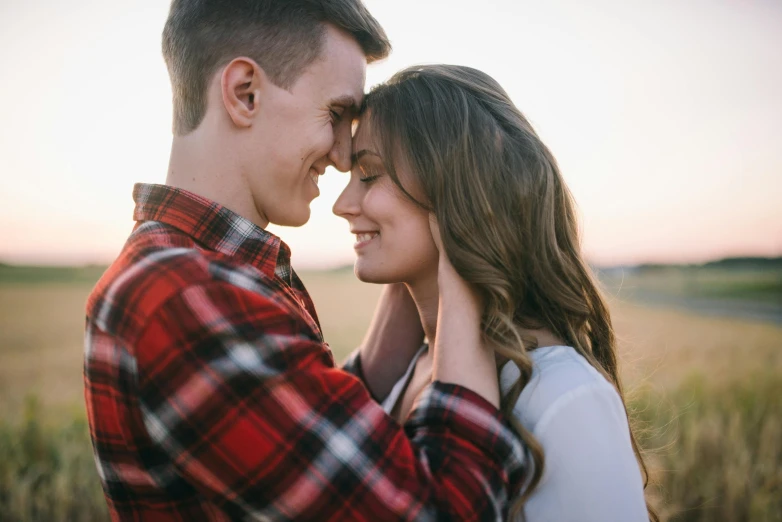 a man and woman standing next to each other in a field, pexels contest winner, happening, redahair and attractive features, wearing a flannel shirt, romantic lead, avatar image