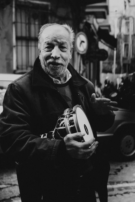 a black and white photo of a man holding a camera, black arts movement, holding a ball, portrait of morgan freeman, ignacio fernández ríos, ffffound