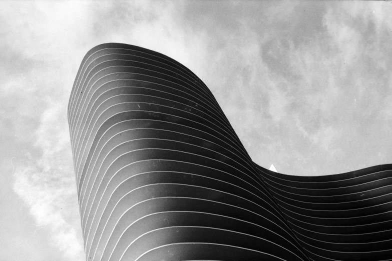 a black and white photo of a building, inspired by Zha Shibiao, unsplash contest winner, albuquerque, behance lemanoosh, curls and curves, skies