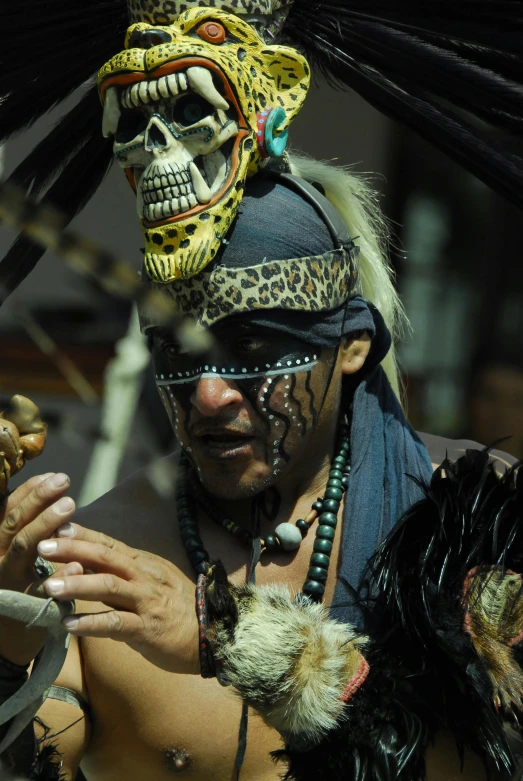 a close up of a person wearing a costume, tribal masks, alligator shaman, eagle feather, classic mayan mythology